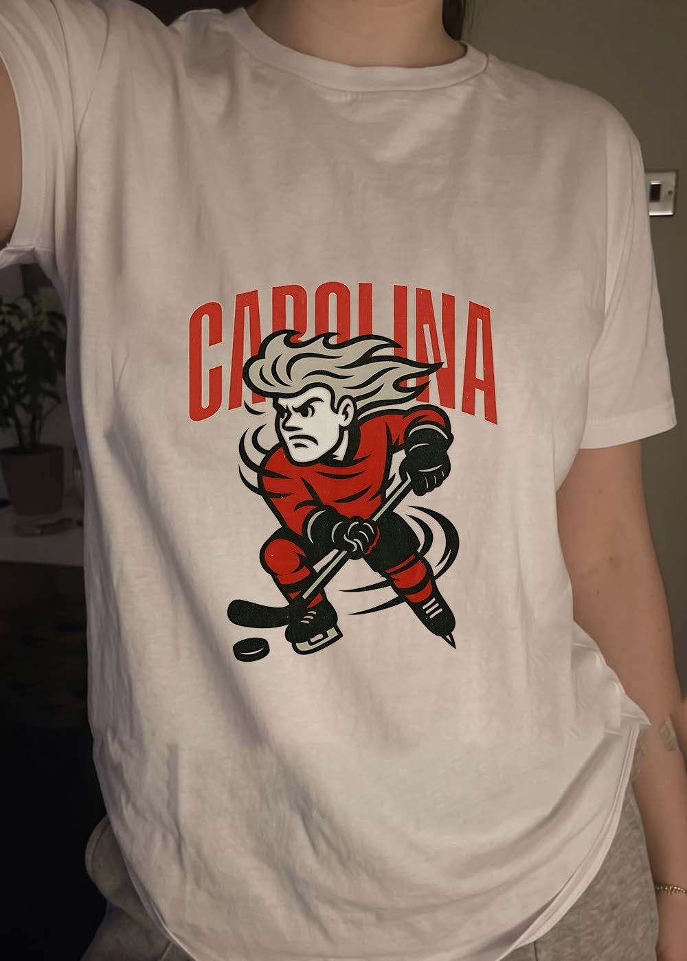 Carolina Hockey Player Skating Puck Graphic Carolina T-Shirt