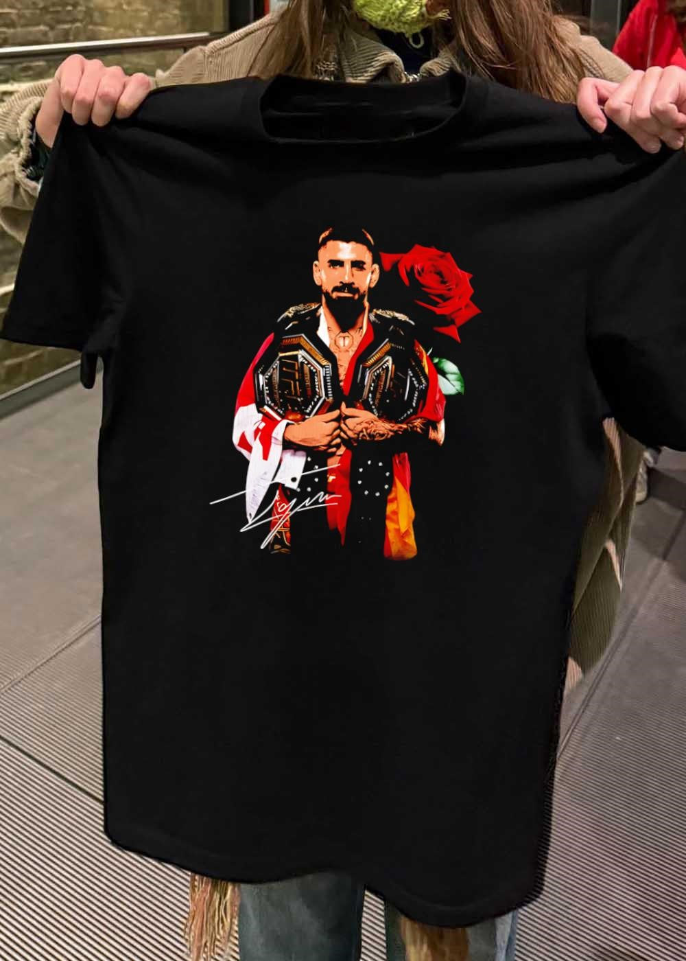 Ilia Topuria Holding UFC Championship Belts With Rose Shirt