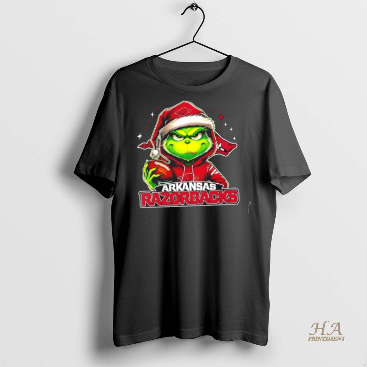 Official Grinch Is Holding A Ball And Smiling At Arkansas Razorbacks Fans Christmas Shirt