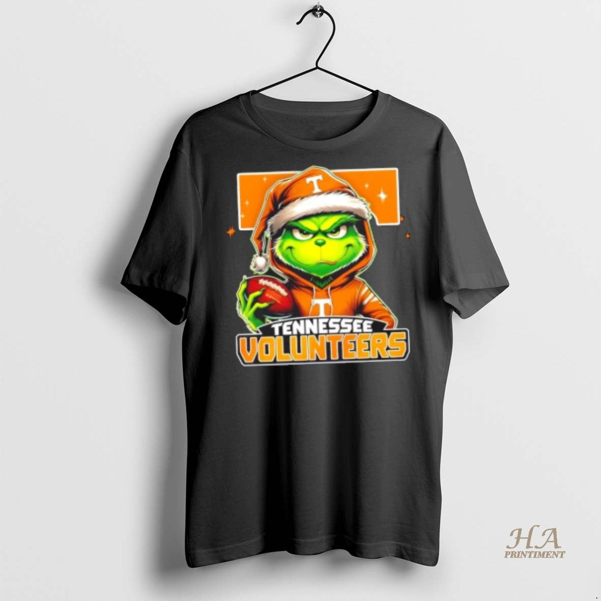 Official Grinch Is Holding A Ball And Smiling At Tennessee Volunteers Fans Christmas Shirt