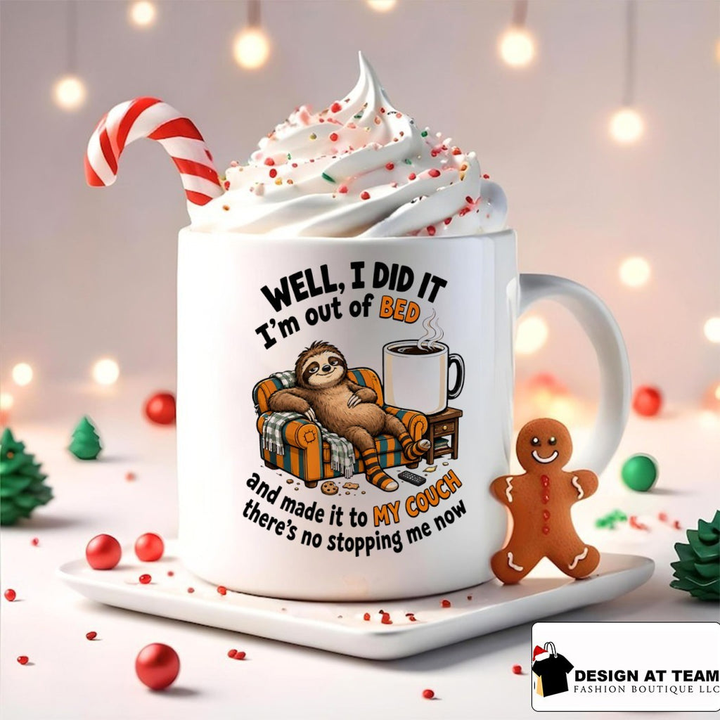 Sloth lounging on couch with mug well I did it I’m out of bed and made it to my shirt