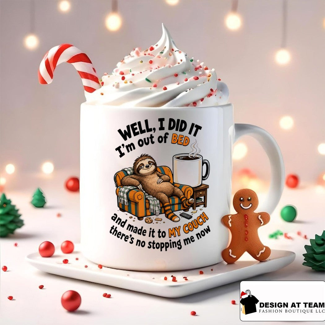 Sloth lounging on couch with mug well I did it I’m out of bed and made it to my shirt