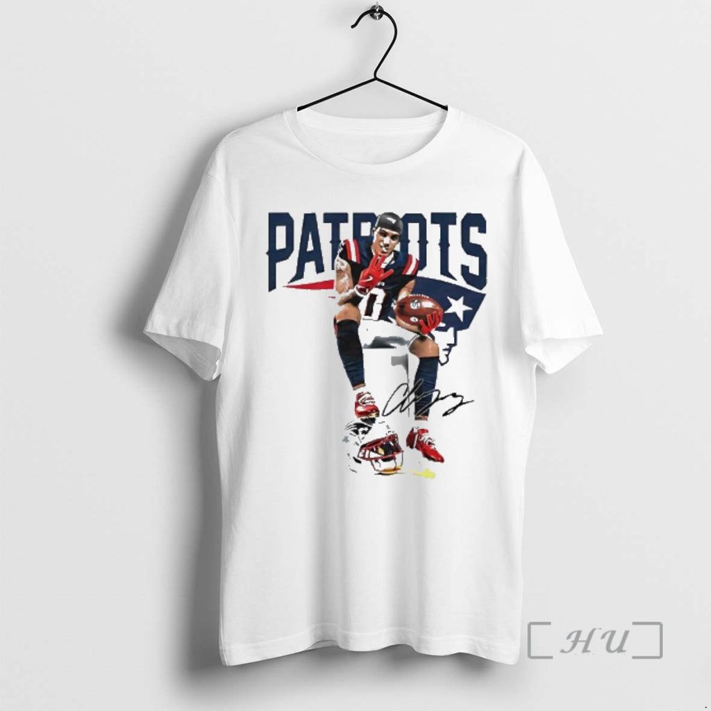 Trending Patriots Christian Gonzalez Sitting On Helmet Holding Football Four Finger Pose Graphic Premium