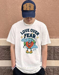 Earth heart love over fear shirt
