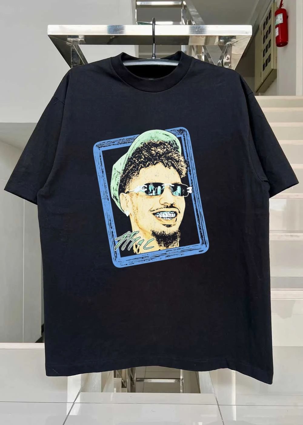 Man with sunglasses and grillz portrait shirt
