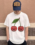A pair of pierced cherries shirt